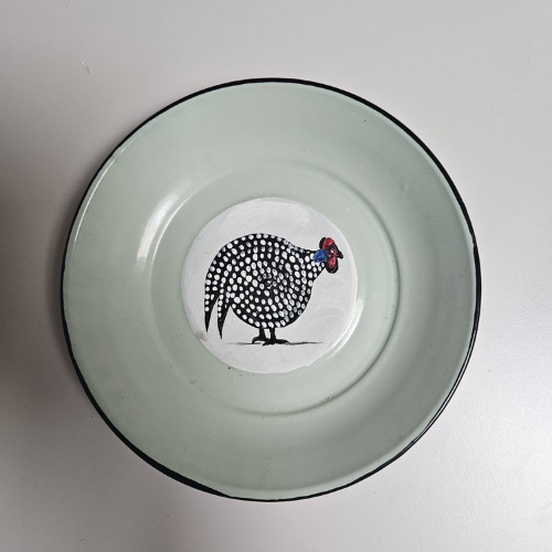 Kango Plate – A  Helmeted Guineafowl on the Front, and on the Back, a Person with a Child on a Bicycle